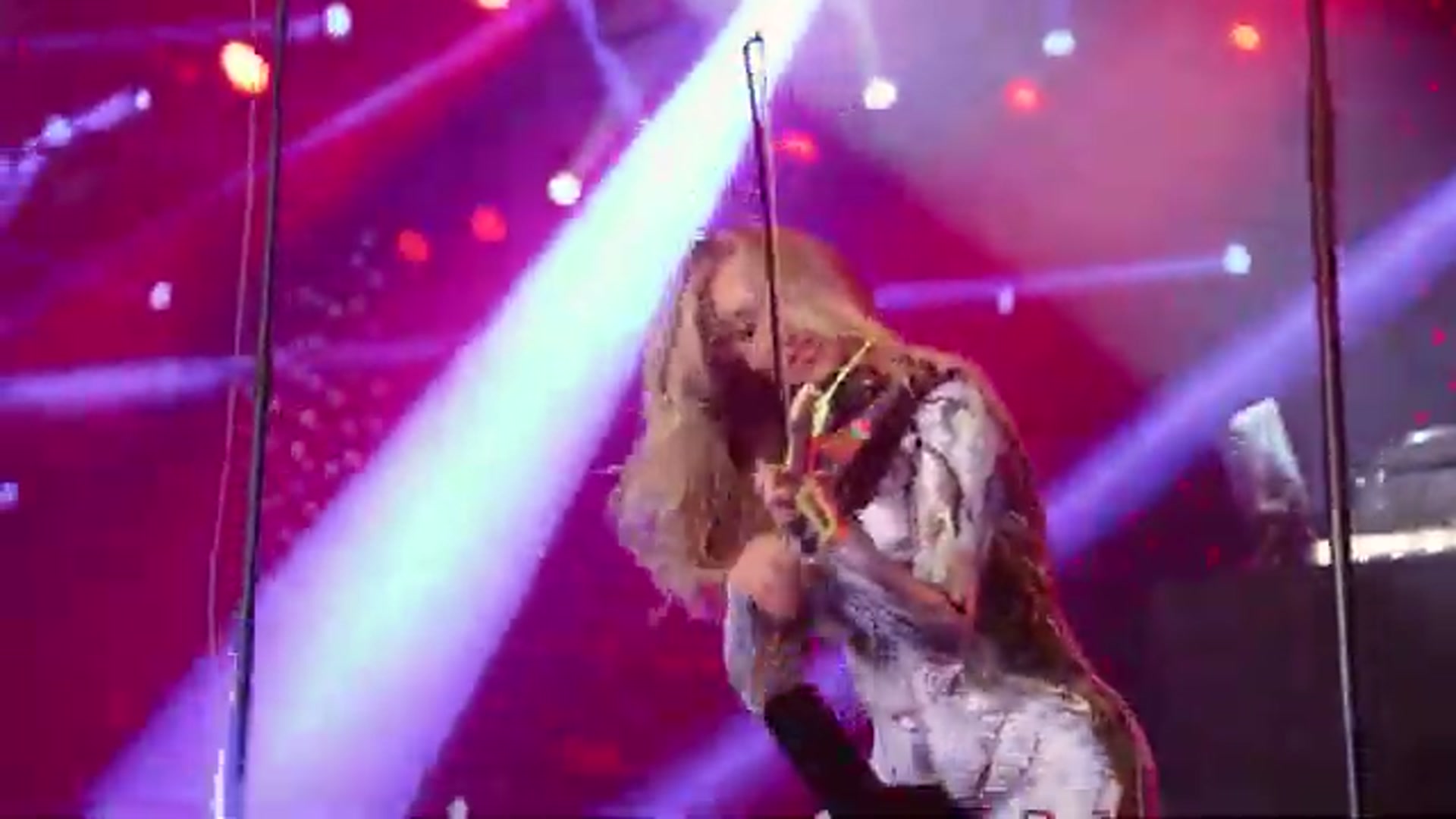 Event entertainment videos: a VYNILYN violinist on a large stage above a packed crowd